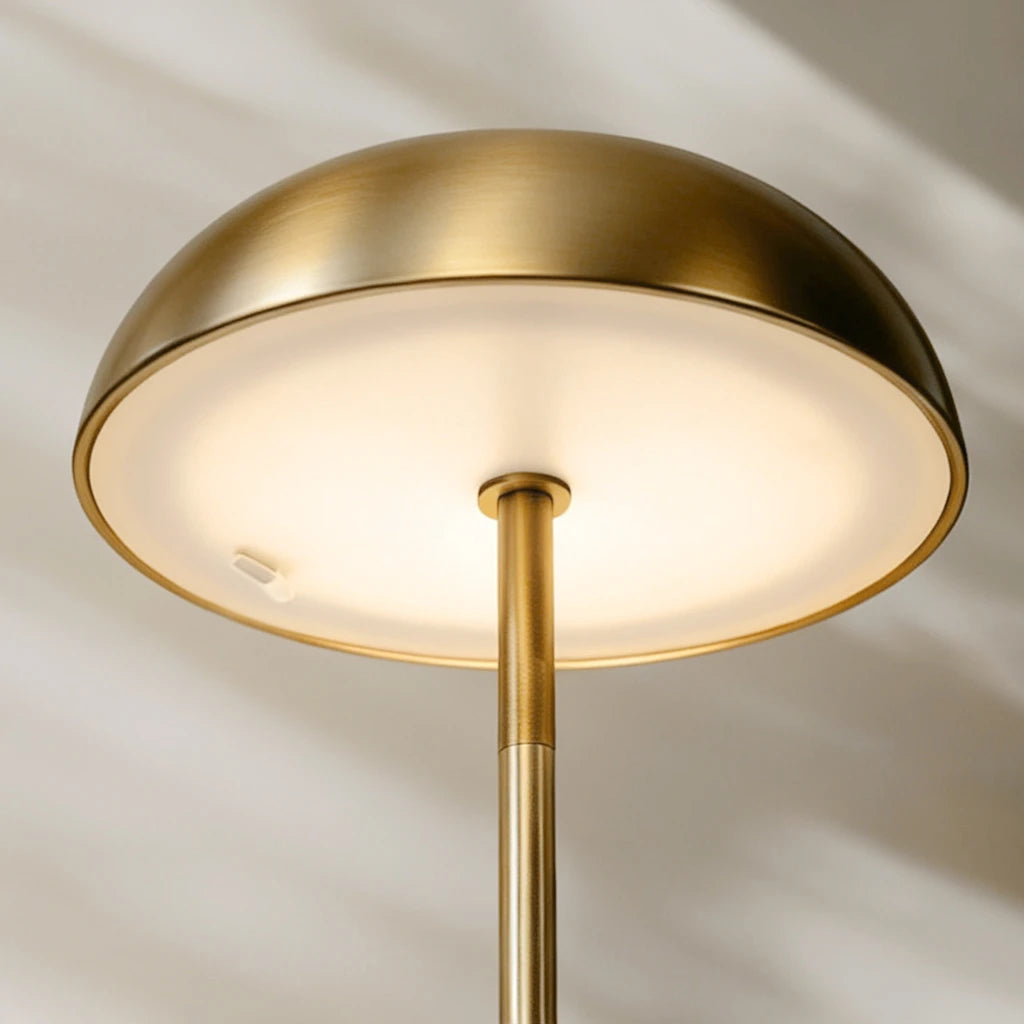 Durable brass-finished portable LED lamp with an advanced electroplated surface designed to maintain its pristine, golden glow.