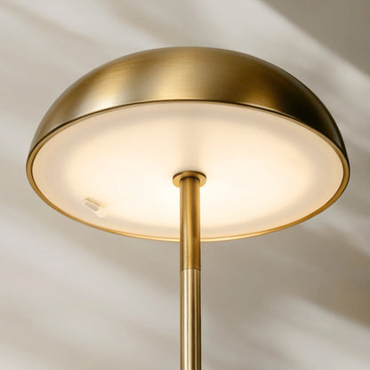 Durable brass-finished portable LED lamp with an advanced electroplated surface designed to maintain its pristine, golden glow.